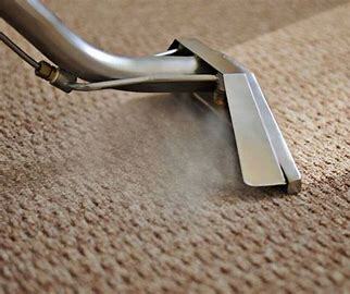 A machine steam cleaning carpet