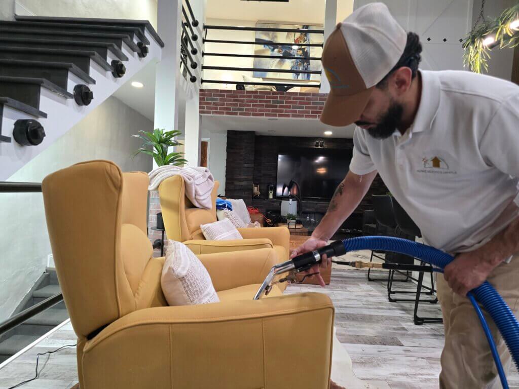 Carpet cleaning technician performing hot water extraction in a Wichita KS home